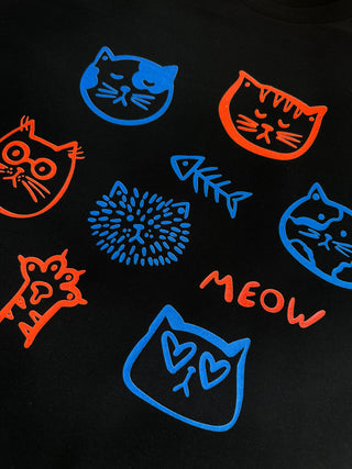 Colorful cat illustrations on a black background