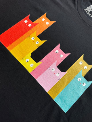 Black t-shirt with colorful cat illustrations in a rainbow pattern.